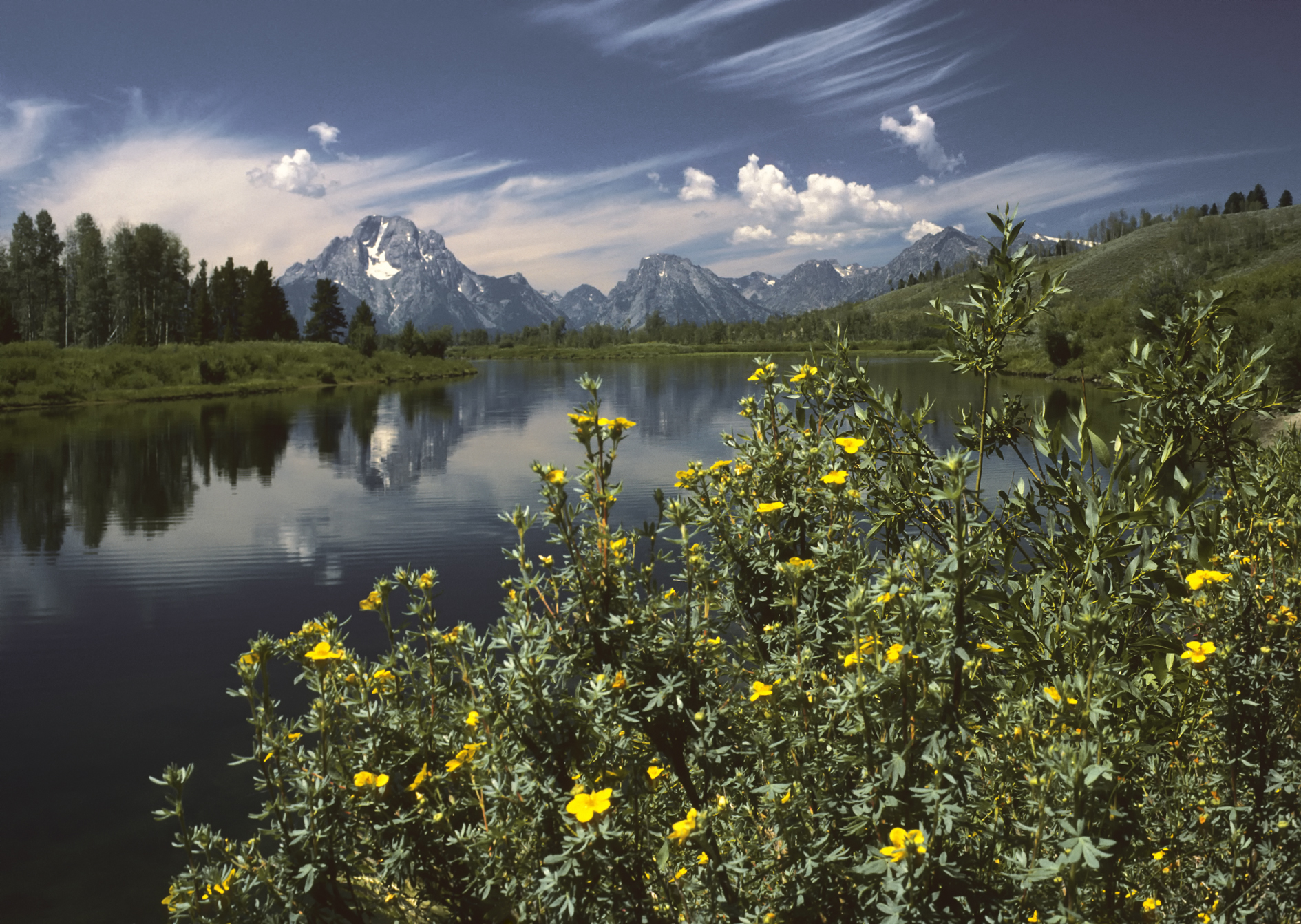 Mount Moran reflected at Oxbow Bend with fall colors in Grand Teton National Park