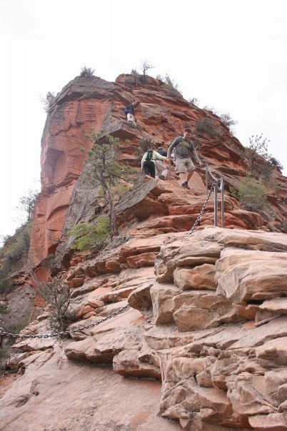 Hikers on the narrow final ascent of Angels Landing in Zion National Park
