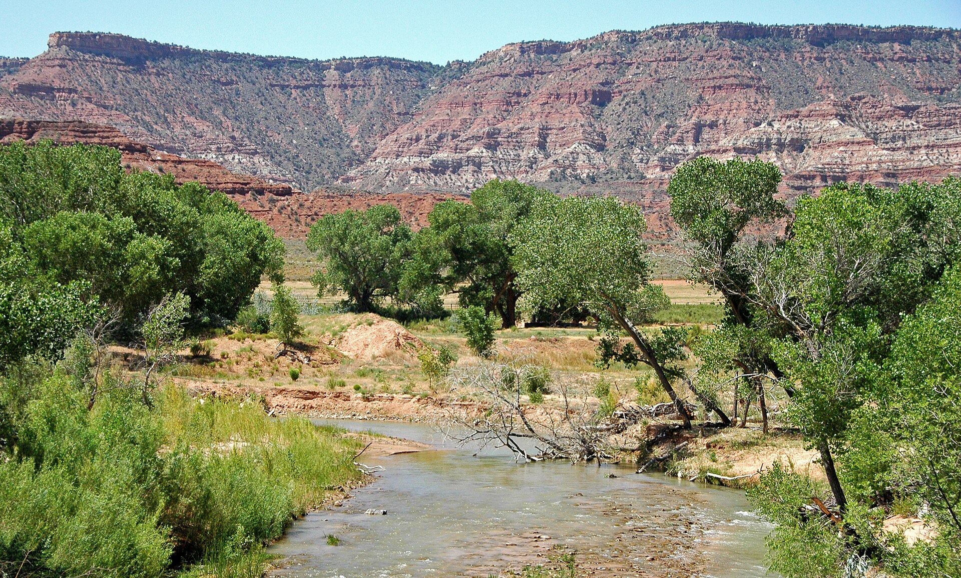 Closest airport to Zion National Park: the Virgin River and red cliffs along the drive between Virgin and Springdale, Utah