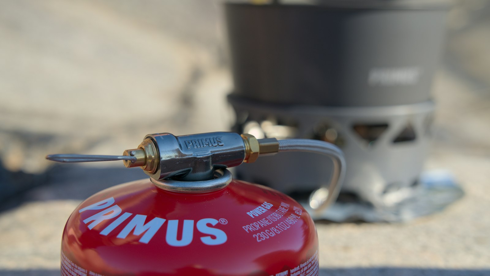 Preparing food on a portable camping stove outdoors