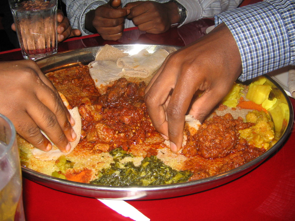 Ethiopian food platter with injera and stews, a must-try cuisine in Washington DC