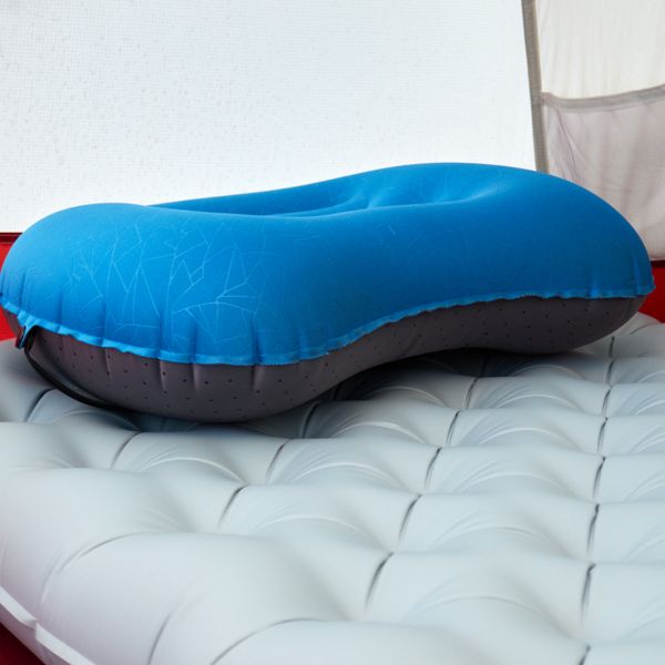 Close-up of an inflatable backpacking sleeping pad inside a tent
