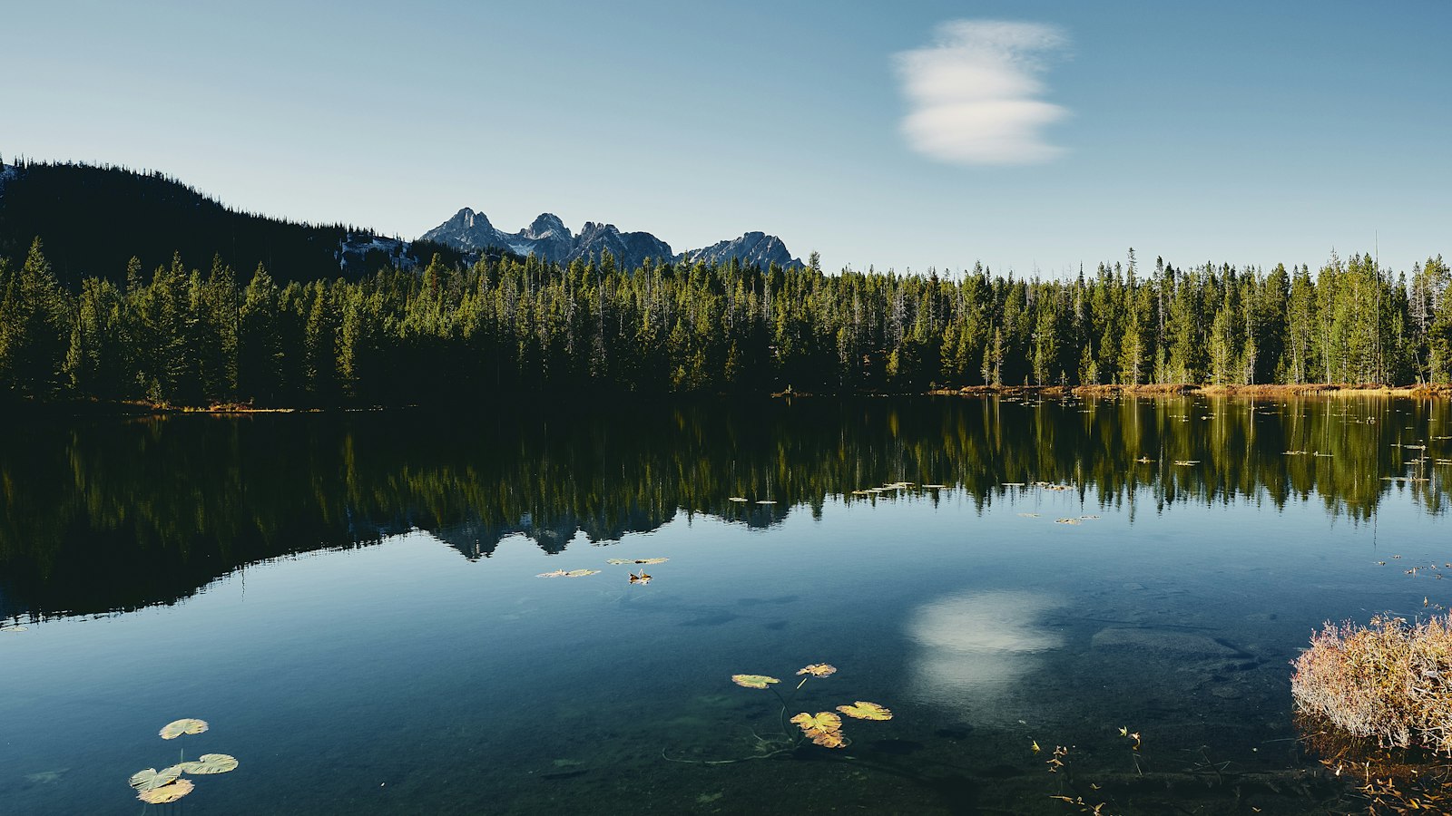 Clear mountain lake surrounded by peaks, a backcountry water source